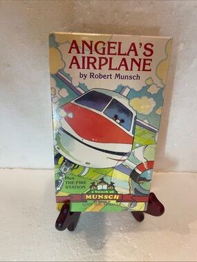 Angela’s airplane VHS by Robert Munsch plus the fire station brand new sealed